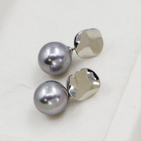 Classic faux pearl earrings with contemporary post
