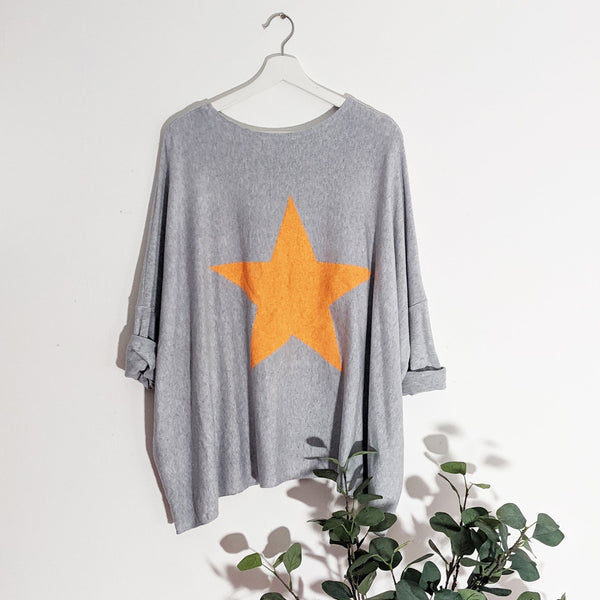 Cosy free size top with bright star motif on back